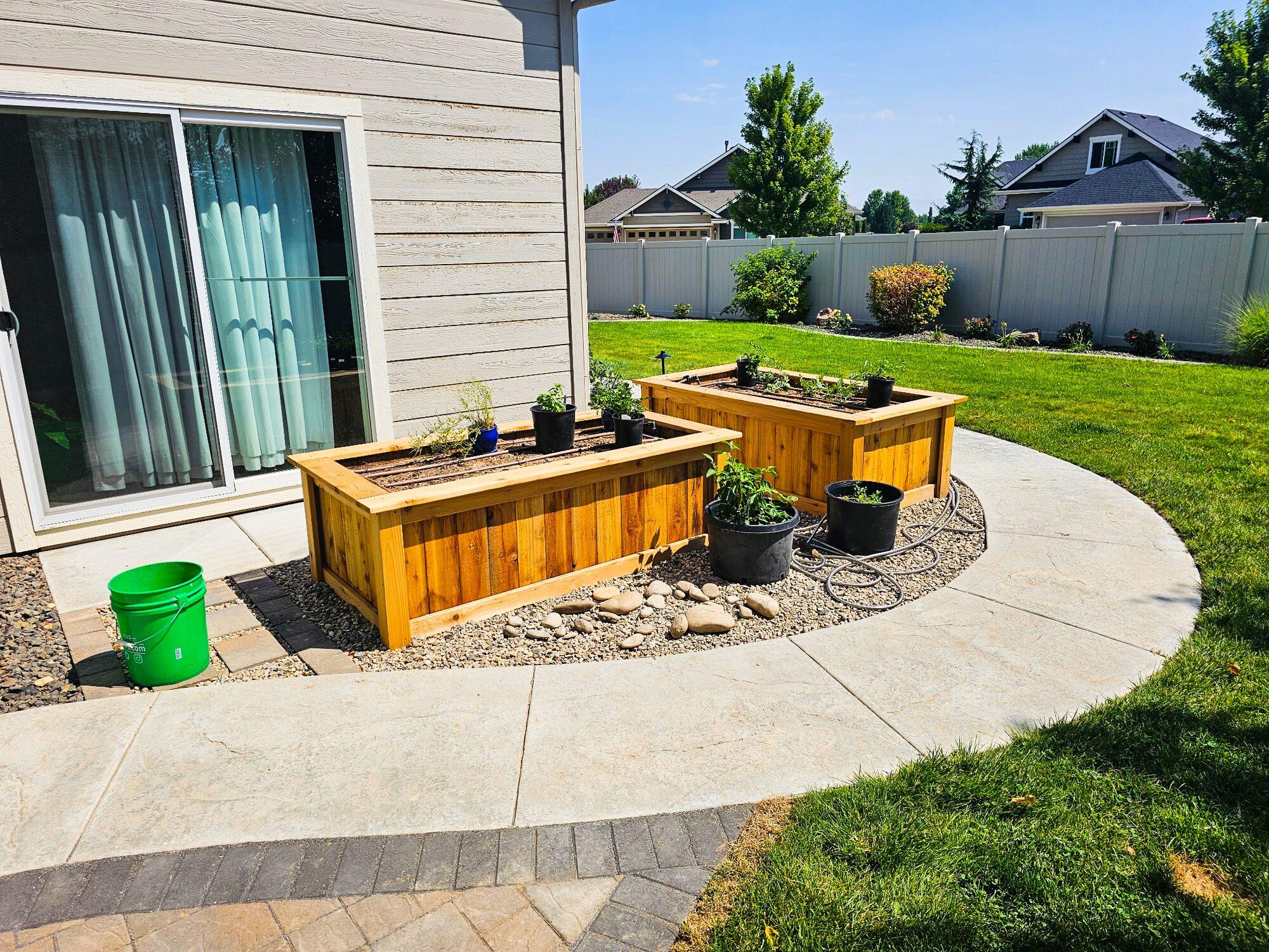 Concrete walkway with garden boxes
