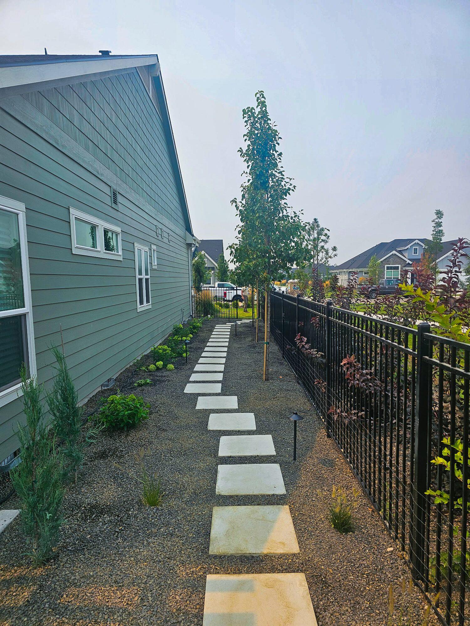Paver stepping stones winding through a garden